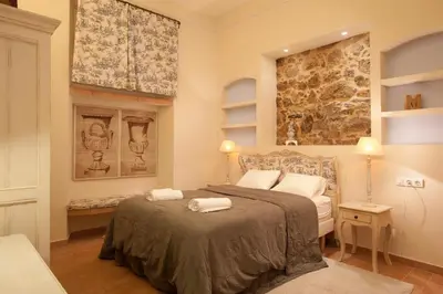 a bedroom with a bed with two towels on it at Romantic In Trendy Gracia in Barcelona