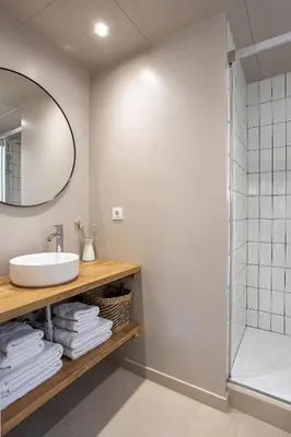 a bathroom with a sink and a shower at Walk To Las Ramblas Sun-filled&cozy in Barcelona