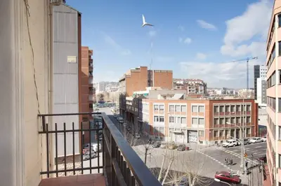 a view of a city street from a balcony at Apt In 22 Close To The Beach in Barcelona