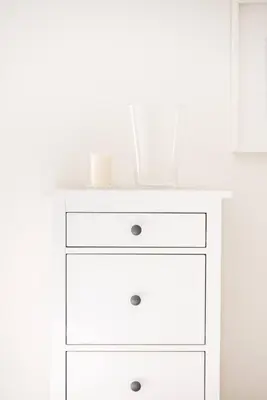a white dresser with a mirror on top of it at Charming Apartment With Vibrant Accents in Hospitalet de Llobregat