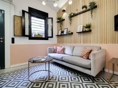 a living room with a couch and a table at Casa Maria Townhouse- terrace-4 bedrooms in Hospitalet de Llobregat
