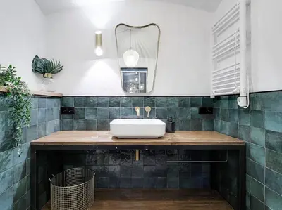 a bathroom with a sink and a mirror at Casa Maria Townhouse- terrace-4 bedrooms in Hospitalet de Llobregat