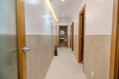 a corridor of a hallway with a door and a hallway at HolidaysBCN Rooms in Barcelona