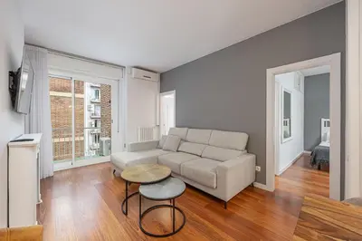 a living room with a couch and a table at Live Like A Local In Bcn in Barcelona