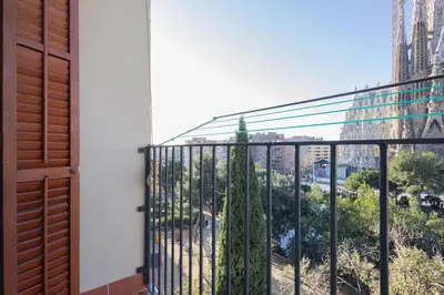 a balcony with a view of a cathedral at Housalia Sagrada Familia Views in Barcelona