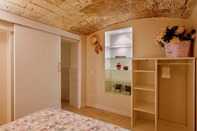 a room with a bed and a coffered ceiling at Gran casa al lado de la playa y Barcelona Centro in Badalona