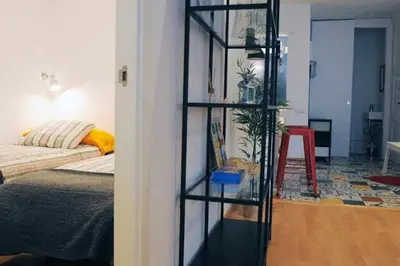 a room with a room with a bed and a shelf at Calm Modern Apartment in Barcelona