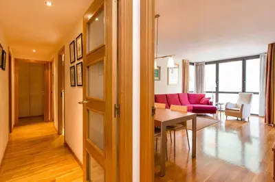 a living room with a pink couch and a table at Fabulous Flat By Paseo De Gracia in Barcelona
