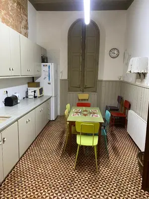 a room with a table and a mirror and a door at Can Martí in Vallgorguina