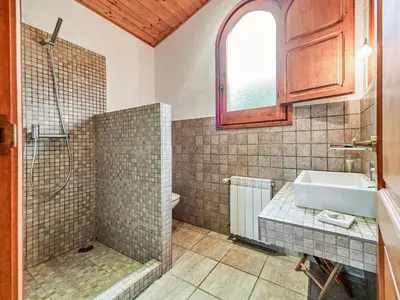 a bathroom with a shower and a sink and a tub at Holiday Home Montseny with Pool in Montseny