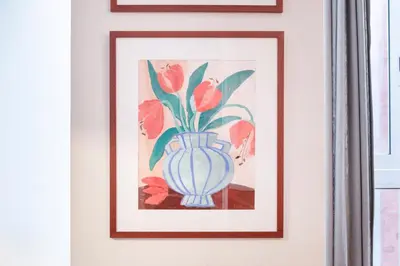 a painting of a vase with flowers on a wall at Modernist apartment in the best location, Eixample in Barcelona