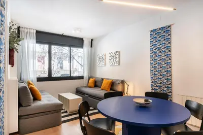 a living room with a couch and a table at Spacious & Comfortable Apartment in Barcelona City Center in Barcelona