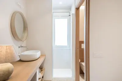 a bathroom with a sink and a mirror at Mediterranean Retreat with 4-Bedroom, 3-Bath Apartment in Barcelona in Barcelona