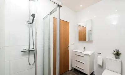 a bathroom with a shower and a toilet and a sink at Maka beach apartment v in Castelldefels
