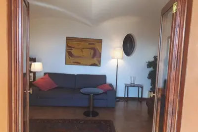 a living room with a blue couch and a table at Magic Place in Barcelona