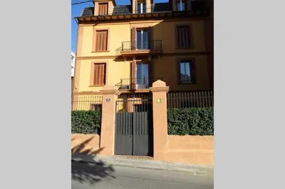 a large building with a gate in front of it at Magic Place in Barcelona