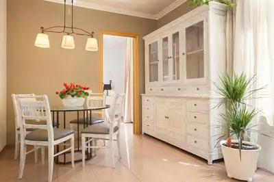 a kitchen and dining room with a table and chairs at BCNGOTIC 11 in Barcelona