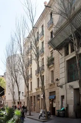 a large brick building with a motorcycle parked in front of it at BCNGOTIC 11 in Barcelona