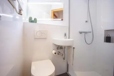 a bathroom with a toilet and a sink and a shower at BCNGOTIC 41 in Barcelona