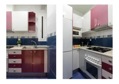 a kitchen with red and white cabinets and a sink at AB Rossello Center Terrace in Barcelona