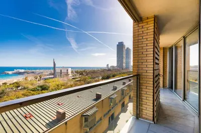 a balcony of a building with a view of the city at Sea views & city skyline in Barcelona