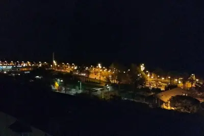 a view of a city at night with lights at Sea views & city skyline in Barcelona