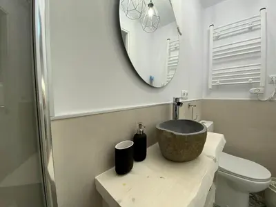 a bathroom with a sink and a mirror at Besos Beach Gem II By MyRentalHost in Sant Adria de Besos