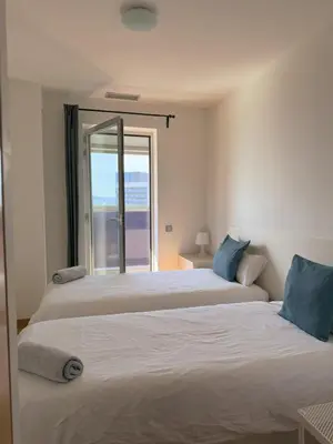 a bedroom with a large bed and a window at Sotell Apartment Gran Via Europa BCN in Las Corts