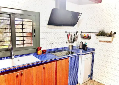 a kitchen with a sink and a window at Masia Pau Prat in Lliçà d'Amunt