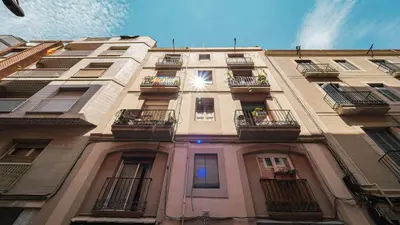 a tall building with balconies on the side of it at Bed&BCN Gracia III in Barcelona