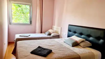 a bedroom with two beds and a window at Forum-CCIB-Relax Flats in Sant Adria de Besos