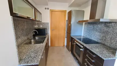 a kitchen with granite counter tops and a sink at Forum-CCIB-Relax Flats in Sant Adria de Besos