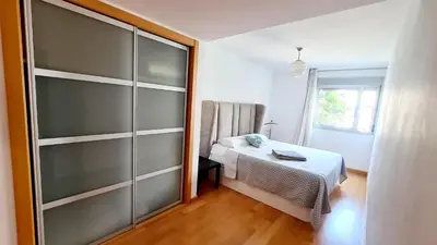 a small bedroom with a bed and a window at Forum-CCIB-Relax Flats in Sant Adria de Besos