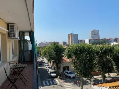 a balcony with a view of a street with cars parked at Vilamarlux V in Vilassar de Mar