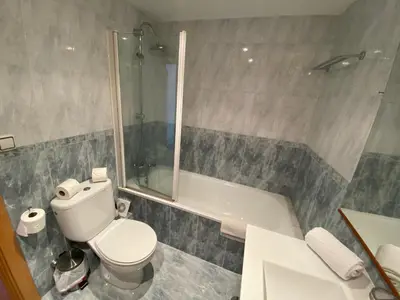 a bathroom with a toilet and a bath tub at Vilamarlux V in Vilassar de Mar