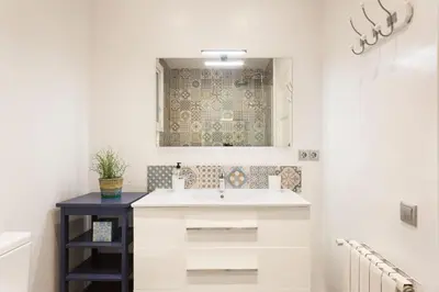 a bathroom with a sink and a mirror at Stay U-nique Apartments Mallorca in Barcelona