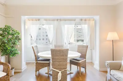 a dining room with a table and chairs and a window at Stay U-nique Apartments Mallorca in Barcelona