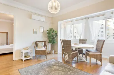 a living room with a table and chairs at Stay U-nique Apartments Mallorca in Barcelona
