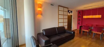 a living room with a table and a dining room at Avenida Diagonal distrito tecnológico 22 arroba - Angeles Terraza in Barcelona
