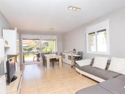 a living room with a couch and a table at Holiday Home Nova by Interhome in Segur de Calafell
