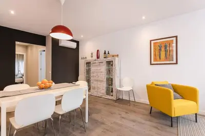 a kitchen and dining room with a table and chairs at 3 Bdr&terrace Close To Subway in Hospitalet de Llobregat