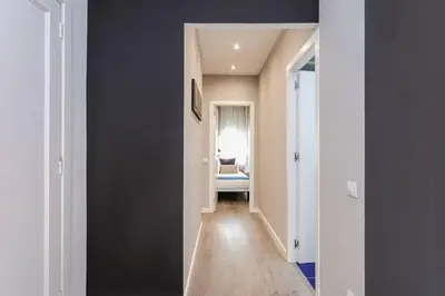 a hallway with a hallway leading to a living room at 3 Bdr&terrace Close To Subway in Hospitalet de Llobregat