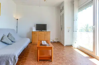 a living room with a couch and a coffee table at Apart Cozy On The Front Line, Liliane in Sitges