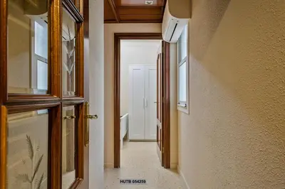 a hallway of a house with a door and a hallwayngth at Alcam Sant Adria in Sant Adria de Besos
