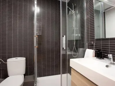 a bathroom with a toilet and a shower and a sink at Sagrada Familia in Barcelona