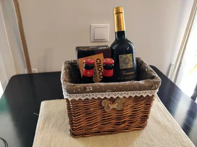 a basket of wine and beer on a table at Bonavista Bright Sea View Studio with Balcony in Calella