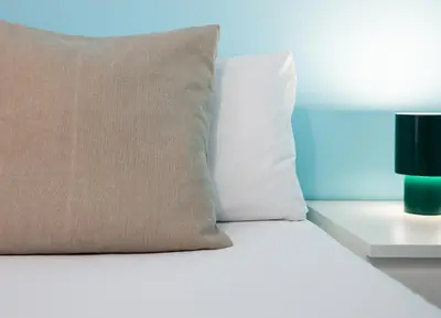 a bed with a pillow and a lamp at Stay U-nique Apartments Radas in Barcelona