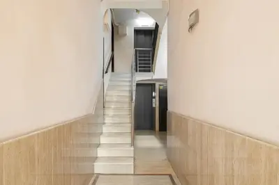 a staircase in a building with white walls and wooden floors at Stay U-nique Apartments Aribau in Barcelona