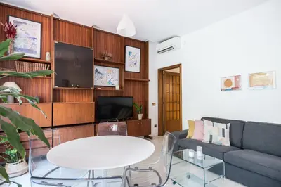 a living room with a couch and a table at Spacious 3 bed Apt in the heart of Sant Antoni, Barcelona in Barcelona