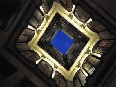an overhead view of a ceiling with a blue sky at BARCELONA GOTIC Guesthouse in Barcelona